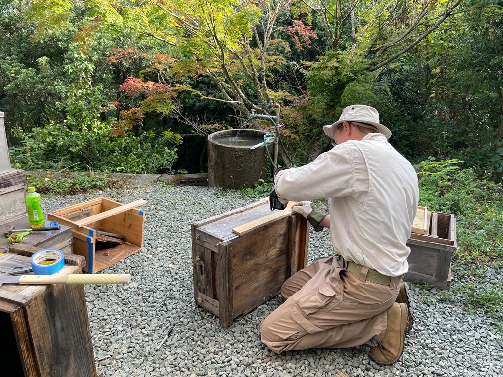 Preparing wooden filming boxes outdoors