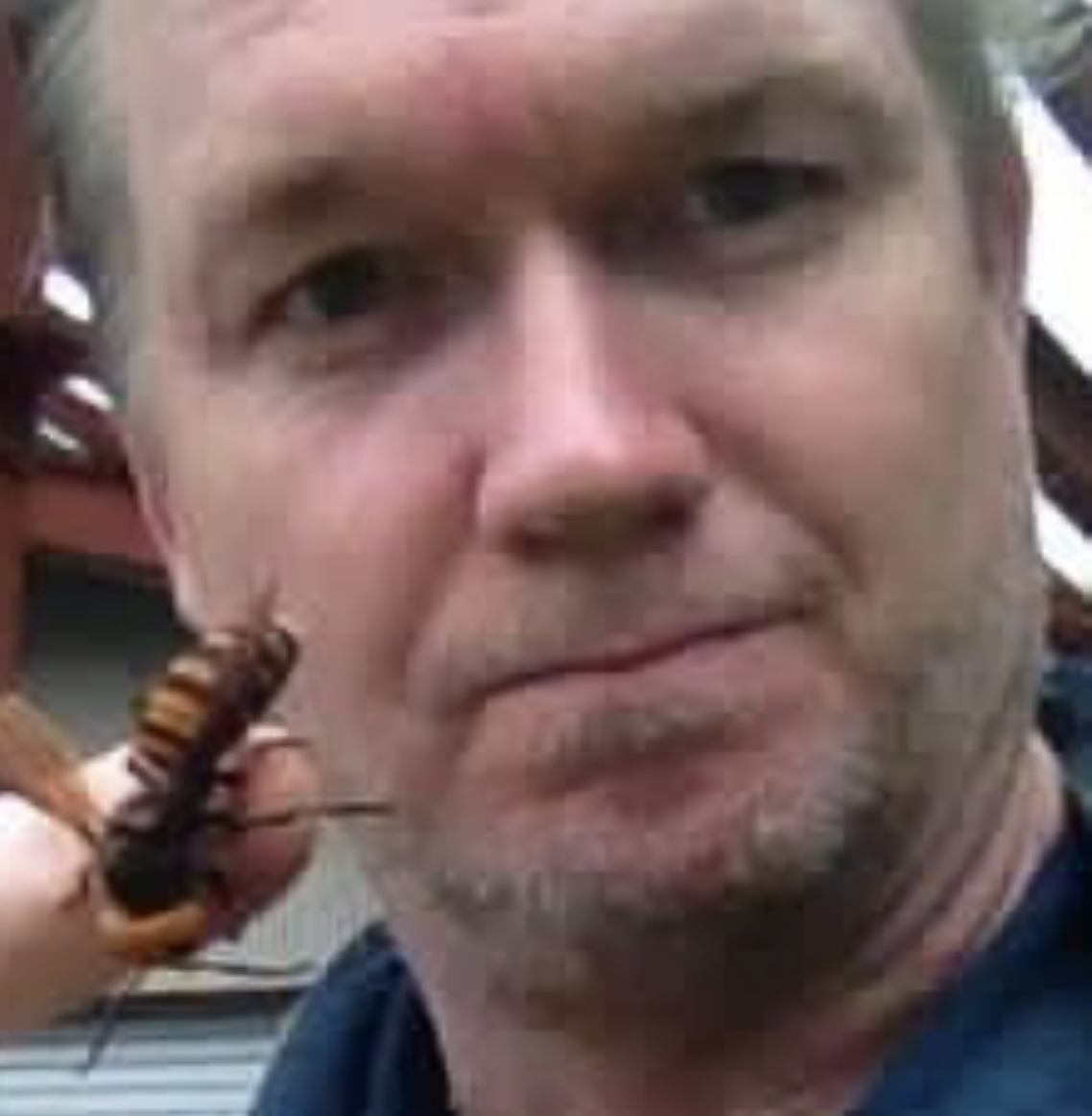 Michael J. Trout with a giant hornet on his finger